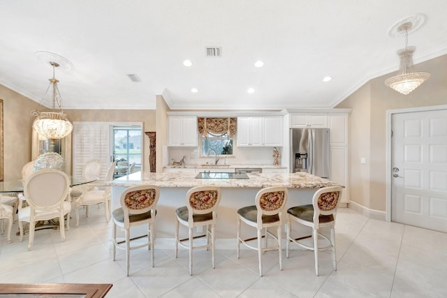 7780 Lake Champlain Ct, Delray Beach, FL 33446 - kitchen with stainless steel fridge with ice dispenser, crown molding, a kitchen island, white cabinets, and a breakfast bar