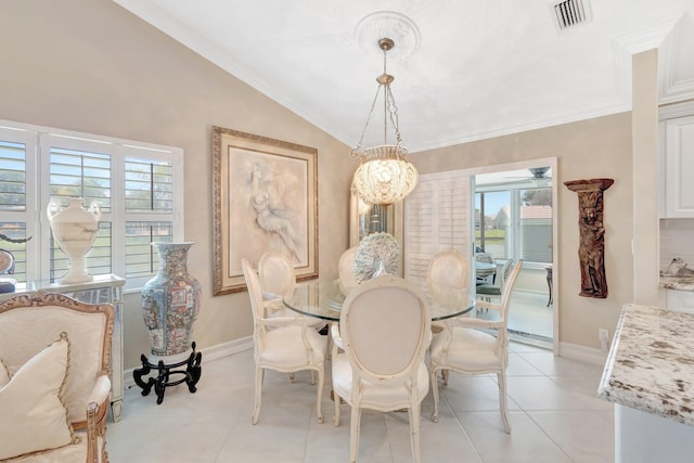 7780 Lake Champlain Ct, Delray Beach, FL 33446 - dining area featuring vaulted ceiling, ornamental molding, baseboards, and light tile patterned floors