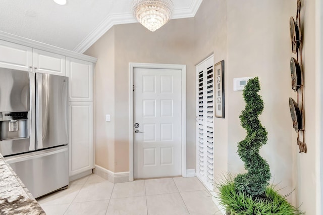 7780 Lake Champlain Ct, Delray Beach, FL 33446 - entryway with ornamental molding, light tile patterned floors, baseboards, and a chandelier