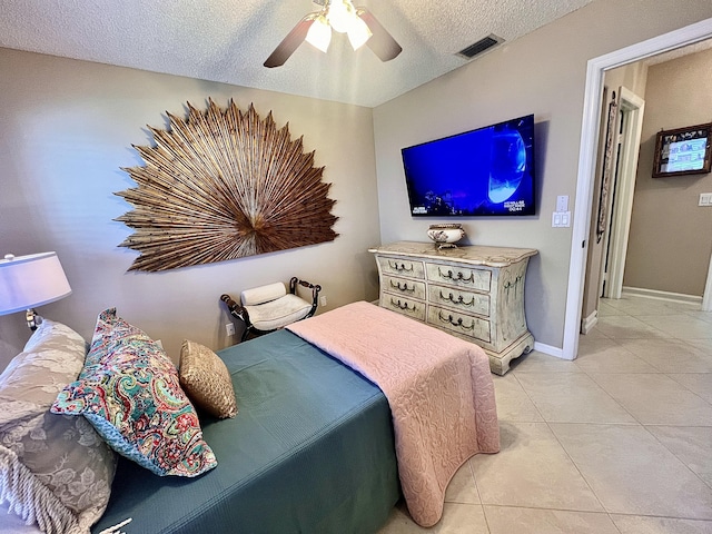 7780 Lake Champlain Ct, Delray Beach, FL 33446 - bedroom featuring light tile patterned flooring, a textured ceiling, ceiling fan, and baseboards