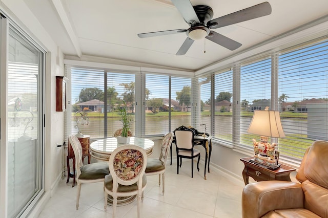 7780 Lake Champlain Ct, Delray Beach, FL 33446 - sunroom featuring baseboards, tile patterned floors, and a water view