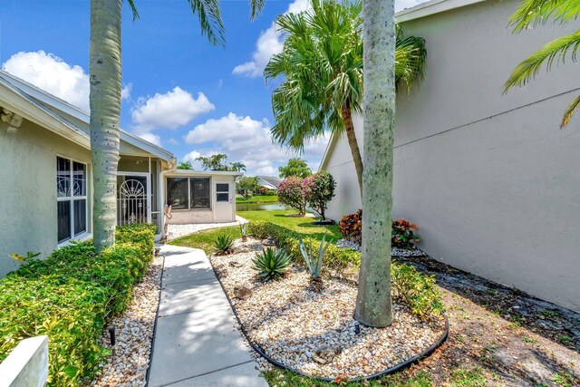 7780 Lake Champlain Ct, Delray Beach, FL 33446 - view of yard with a sunroom