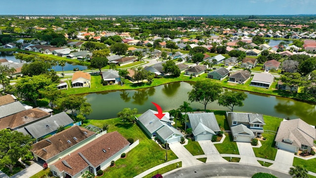 7780 Lake Champlain Ct, Delray Beach, FL 33446 - aerial overview of property's location featuring a large body of water and nearby suburban area