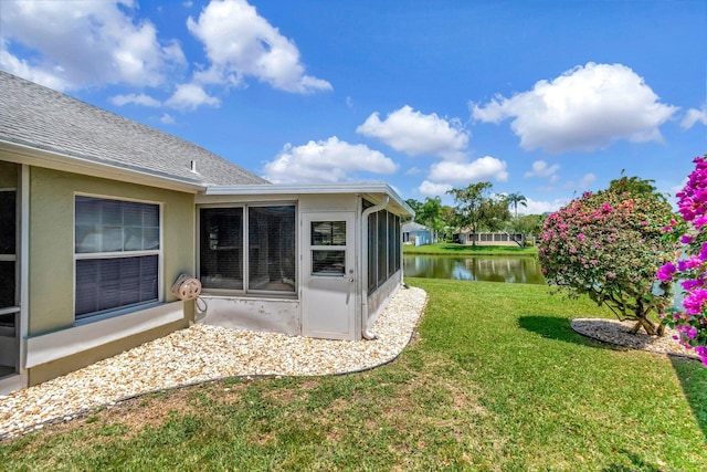 7780 Lake Champlain Ct, Delray Beach, FL 33446 - view of green lawn with a water view and a sunroom