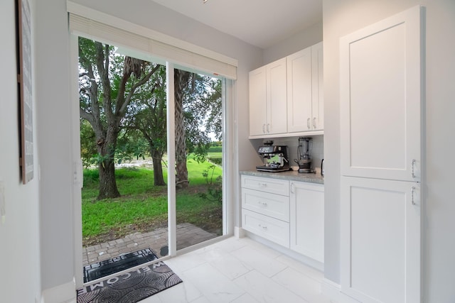 3185 Laurel Ridge Cir, Riviera Beach, FL 33404 - doorway to outside featuring light marble finish flooring