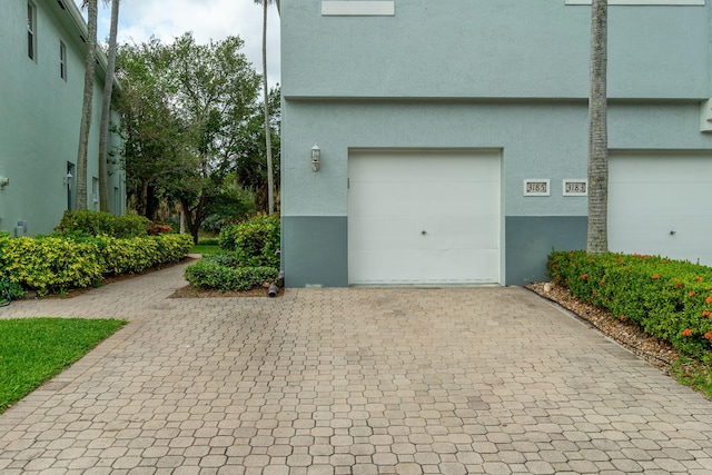 3185 Laurel Ridge Cir, Riviera Beach, FL 33404 - garage with decorative driveway