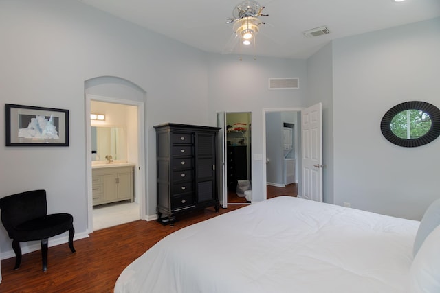 3185 Laurel Ridge Cir, Riviera Beach, FL 33404 - bedroom featuring dark wood-type flooring, baseboards, ensuite bathroom, a sink, and ceiling fan
