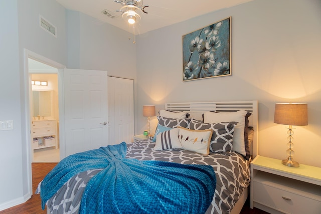 3185 Laurel Ridge Cir, Riviera Beach, FL 33404 - bedroom with wood finished floors, a closet, and baseboards