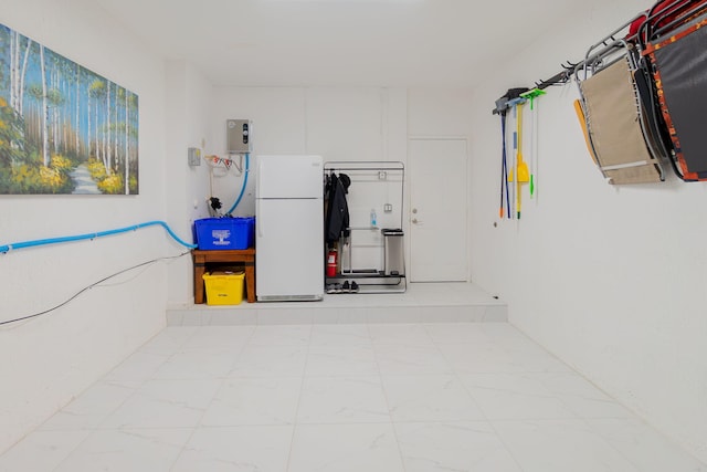 3185 Laurel Ridge Cir, Riviera Beach, FL 33404 - garage featuring freestanding refrigerator