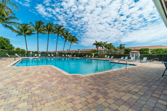 3185 Laurel Ridge Cir, Riviera Beach, FL 33404 - community pool featuring a patio area