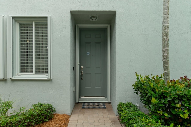 3185 Laurel Ridge Cir, Riviera Beach, FL 33404 - entrance to property featuring stucco siding