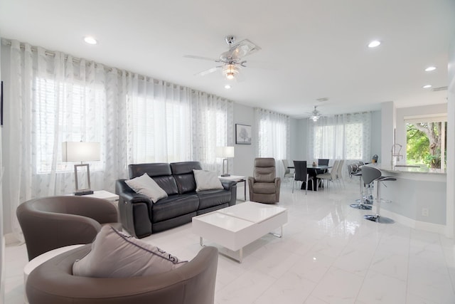 3185 Laurel Ridge Cir, Riviera Beach, FL 33404 - living room with a ceiling fan, recessed lighting, baseboards, and light marble finish floors