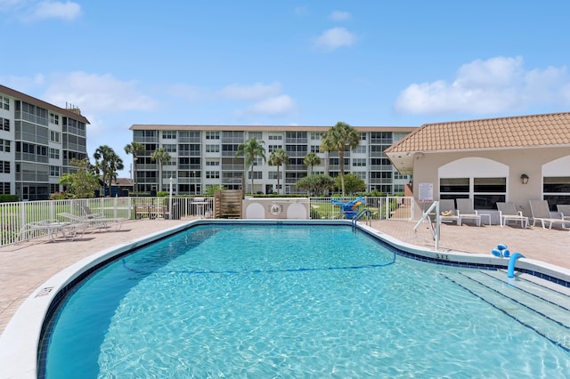 911 Gardenia Dr Unit 252, Delray Beach, FL 33483 - community pool featuring a patio area