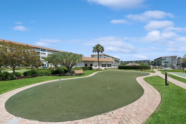 911 Gardenia Dr Unit 252, Delray Beach, FL 33483 - view of home's community featuring an area to practice putting and a yard