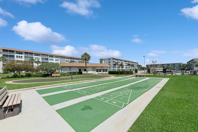 911 Gardenia Dr Unit 252, Delray Beach, FL 33483 - surrounding community with a lawn and shuffleboard