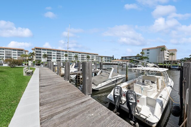 911 Gardenia Dr Unit 252, Delray Beach, FL 33483 - dock featuring a lawn and a water view