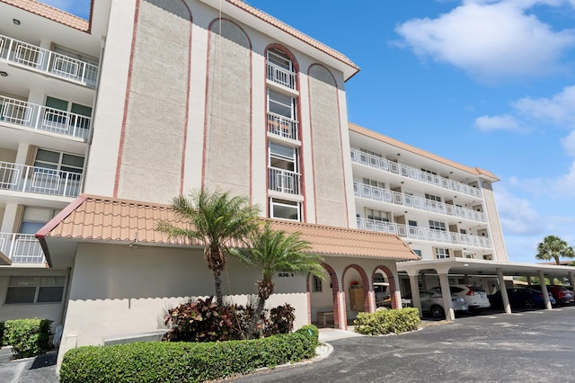 911 Gardenia Dr Unit 252, Delray Beach, FL 33483 - view of apartment building / complex with covered parking