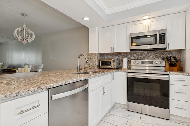 911 Gardenia Dr Unit 252, Delray Beach, FL 33483 - kitchen featuring appliances with stainless steel finishes, a sink, recessed lighting, light stone countertops, and ornamental molding