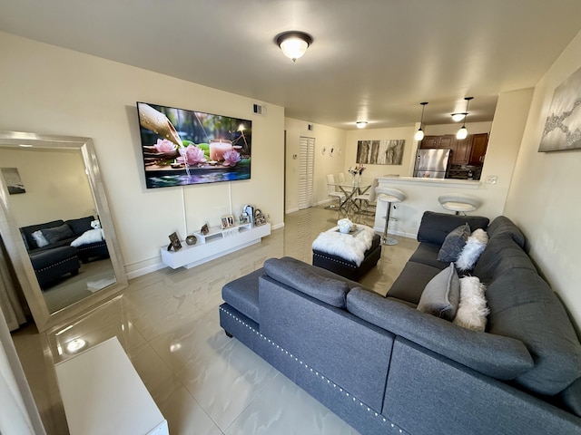 3280 NW 104th Ave Unit 3280, Coral Springs, FL 33065 - living room with marble look tiles and baseboards
