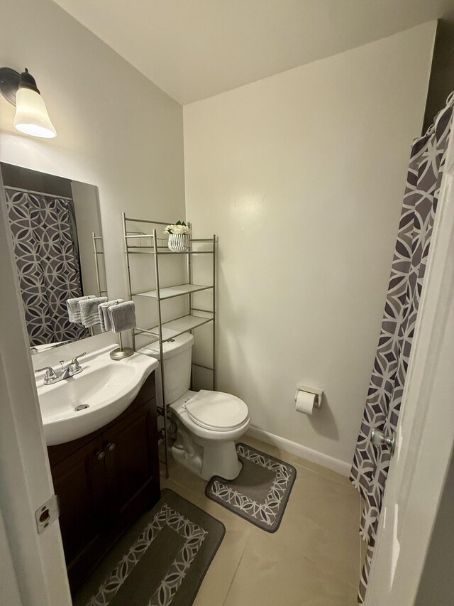 3280 NW 104th Ave Unit 3280, Coral Springs, FL 33065 - full bath featuring toilet, vanity, tile patterned floors, and baseboards