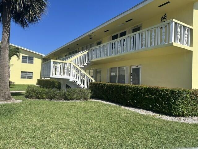 105 Sheffield E, West Palm Beach, FL 33417 - view of property featuring stairs
