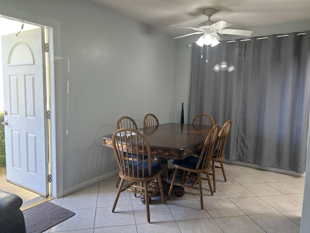 105 Sheffield E, West Palm Beach, FL 33417 - dining space with light tile patterned floors, ceiling fan, a textured ceiling, and baseboards