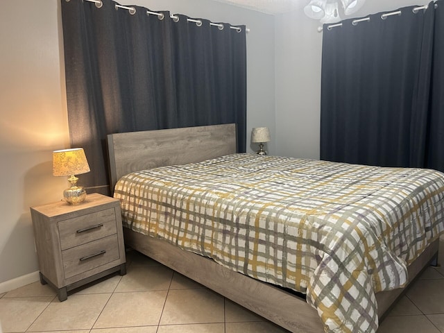 105 Sheffield E, West Palm Beach, FL 33417 - bedroom featuring light tile patterned flooring and baseboards