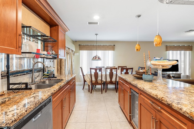 6815 Farragut Ln, Boynton Beach, FL 33437 - kitchen with wine cooler, a sink, stainless steel dishwasher, brown cabinets, and decorative light fixtures
