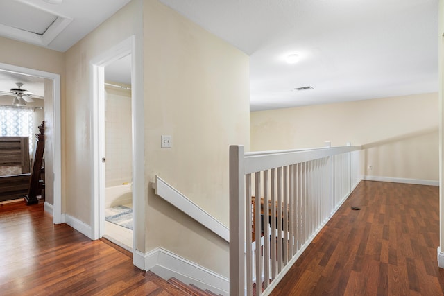 6815 Farragut Ln, Boynton Beach, FL 33437 - corridor with wood finished floors, baseboards, and an upstairs landing