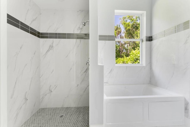 675 NE Moss Rose Pl, Port Saint Lucie, FL 34983 - full bath featuring a bath and a marble finish shower