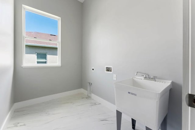 675 NE Moss Rose Pl, Port Saint Lucie, FL 34983 - laundry area with hookup for an electric dryer, washer hookup, marble finish floors, and baseboards