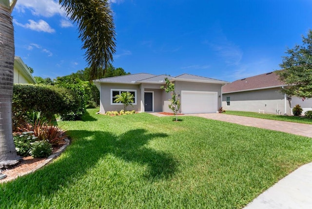 675 NE Moss Rose Pl, Port Saint Lucie, FL 34983 - view of front of home featuring decorative driveway, stucco siding, a garage, and a front lawn