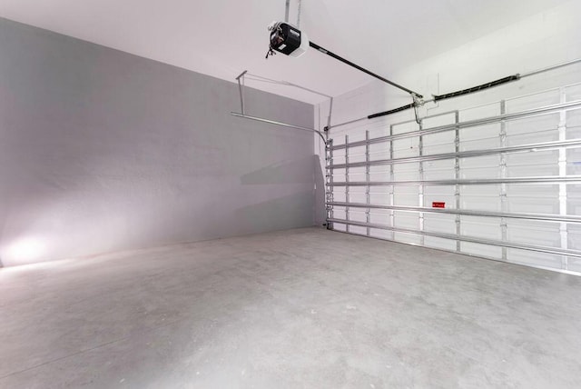 675 NE Moss Rose Pl, Port Saint Lucie, FL 34983 - garage featuring a garage door opener
