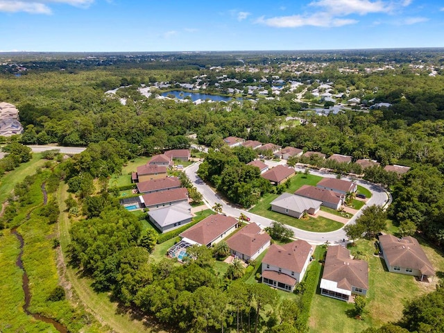 675 NE Moss Rose Pl, Port Saint Lucie, FL 34983 - aerial view of property's location with a nearby body of water and nearby suburban area