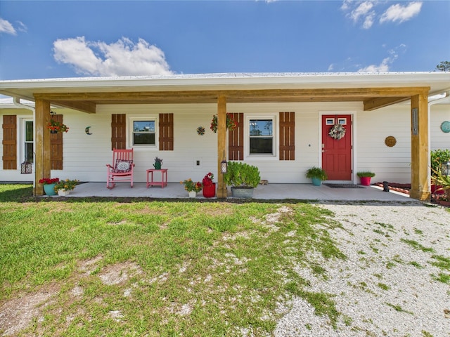 32801 US Highway 441 13 & 14, Okeechobee, FL 34972 - ranch-style house with covered porch and a front yard