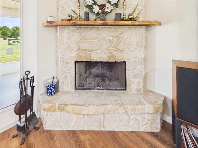 32801 US Highway 441 13 & 14, Okeechobee, FL 34972 - detailed view of wood finished floors, baseboards, and a fireplace
