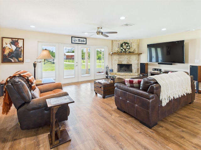 32801 US Highway 441 13 & 14, Okeechobee, FL 34972 - living room with a ceiling fan, wood finished floors, recessed lighting, a fireplace, and french doors