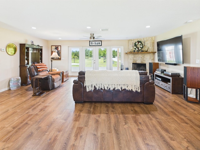 32801 US Highway 441 13 & 14, Okeechobee, FL 34972 - living room featuring a ceiling fan, wood finished floors, recessed lighting, a fireplace, and french doors