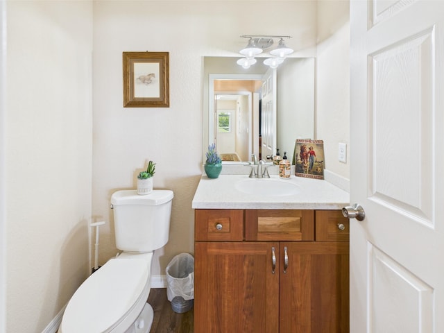 32801 US Highway 441 13 & 14, Okeechobee, FL 34972 - bathroom with toilet, vanity, and baseboards