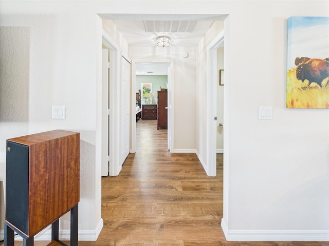 32801 US Highway 441 13 & 14, Okeechobee, FL 34972 - hallway featuring wood finished floors and baseboards