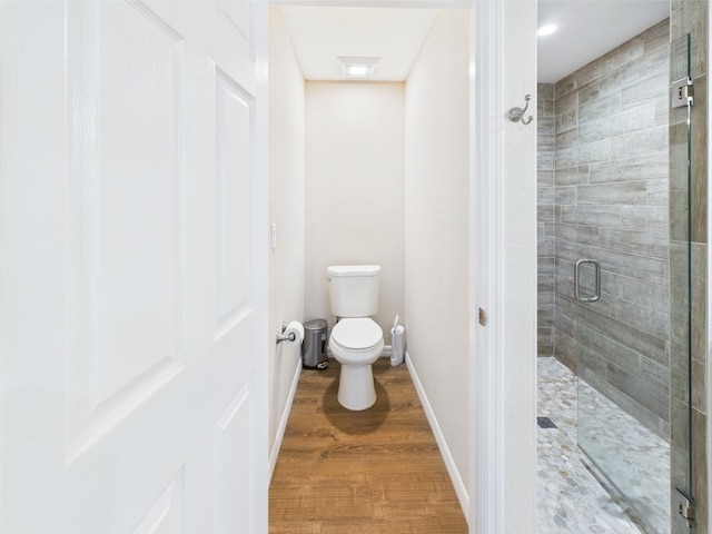 32801 US Highway 441 13 & 14, Okeechobee, FL 34972 - bathroom featuring a shower stall, toilet, wood finished floors, and baseboards