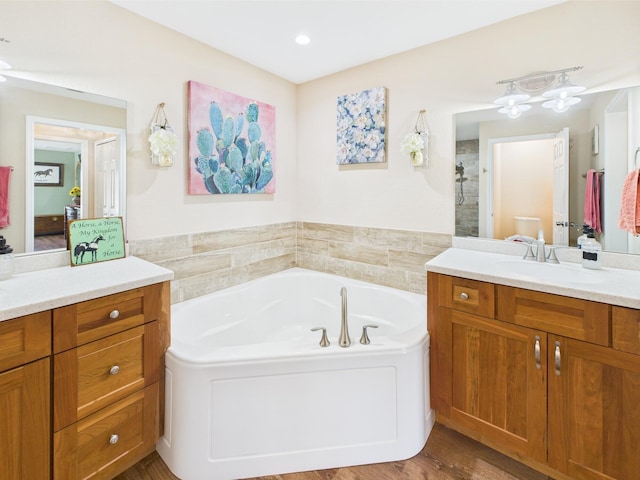 32801 US Highway 441 13 & 14, Okeechobee, FL 34972 - bathroom featuring vanity, a bath, walk in shower, wood finished floors, and recessed lighting