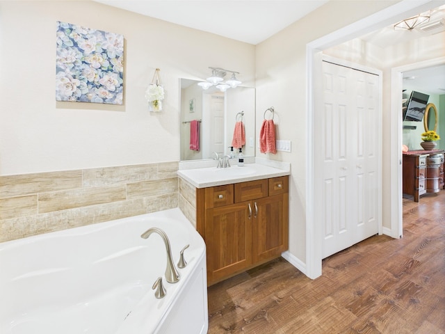 32801 US Highway 441 13 & 14, Okeechobee, FL 34972 - full bath featuring vanity, a garden tub, and wood finished floors