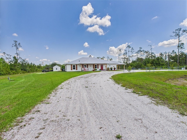 32801 US Highway 441 13 & 14, Okeechobee, FL 34972 - single story home featuring driveway, a front yard, metal roof, and a chimney