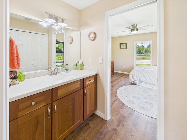 32801 US Highway 441 13 & 14, Okeechobee, FL 34972 - bathroom with vanity, wood finished floors, baseboards, and ceiling fan