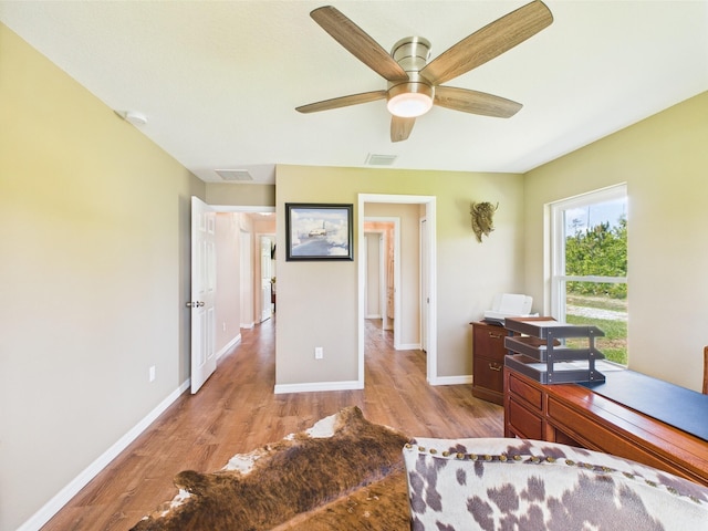 32801 US Highway 441 13 & 14, Okeechobee, FL 34972 - bedroom featuring light wood finished floors, baseboards, and a ceiling fan