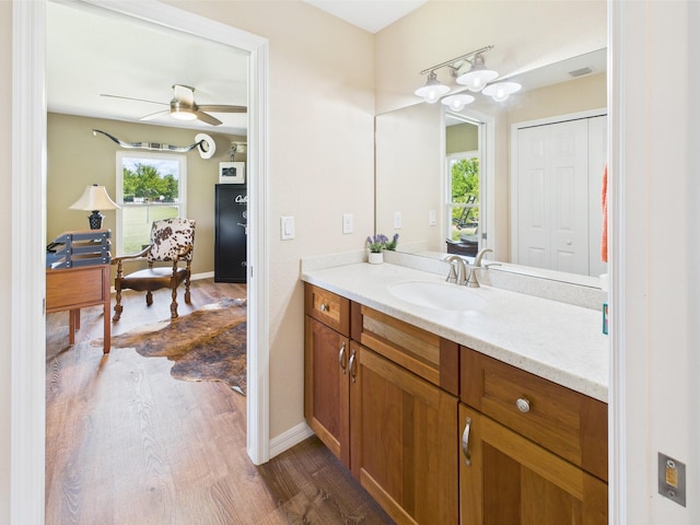 32801 US Highway 441 13 & 14, Okeechobee, FL 34972 - bathroom featuring wood finished floors, vanity, ceiling fan, and baseboards