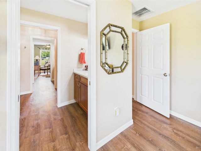 32801 US Highway 441 13 & 14, Okeechobee, FL 34972 - corridor featuring wood finished floors and baseboards