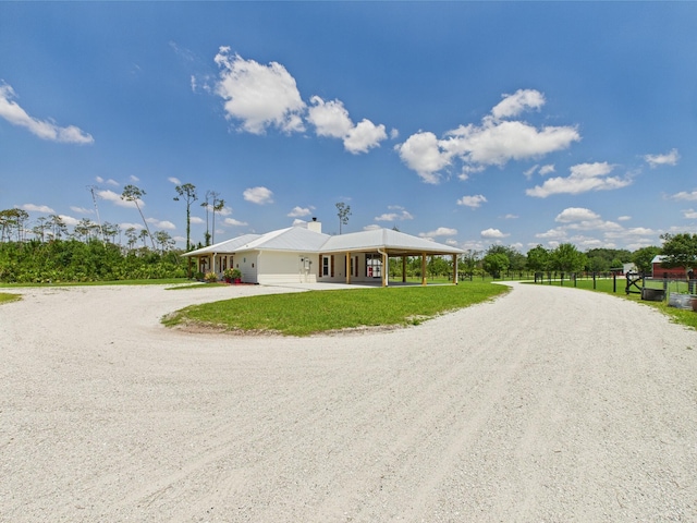 32801 US Highway 441 13 & 14, Okeechobee, FL 34972 - view of home's exterior with driveway and a chimney