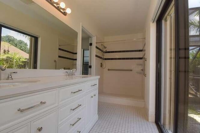 11405 Whisper Lake Way, Boca Raton, FL 33428 - bathroom featuring a shower, tile patterned floors, and double vanity